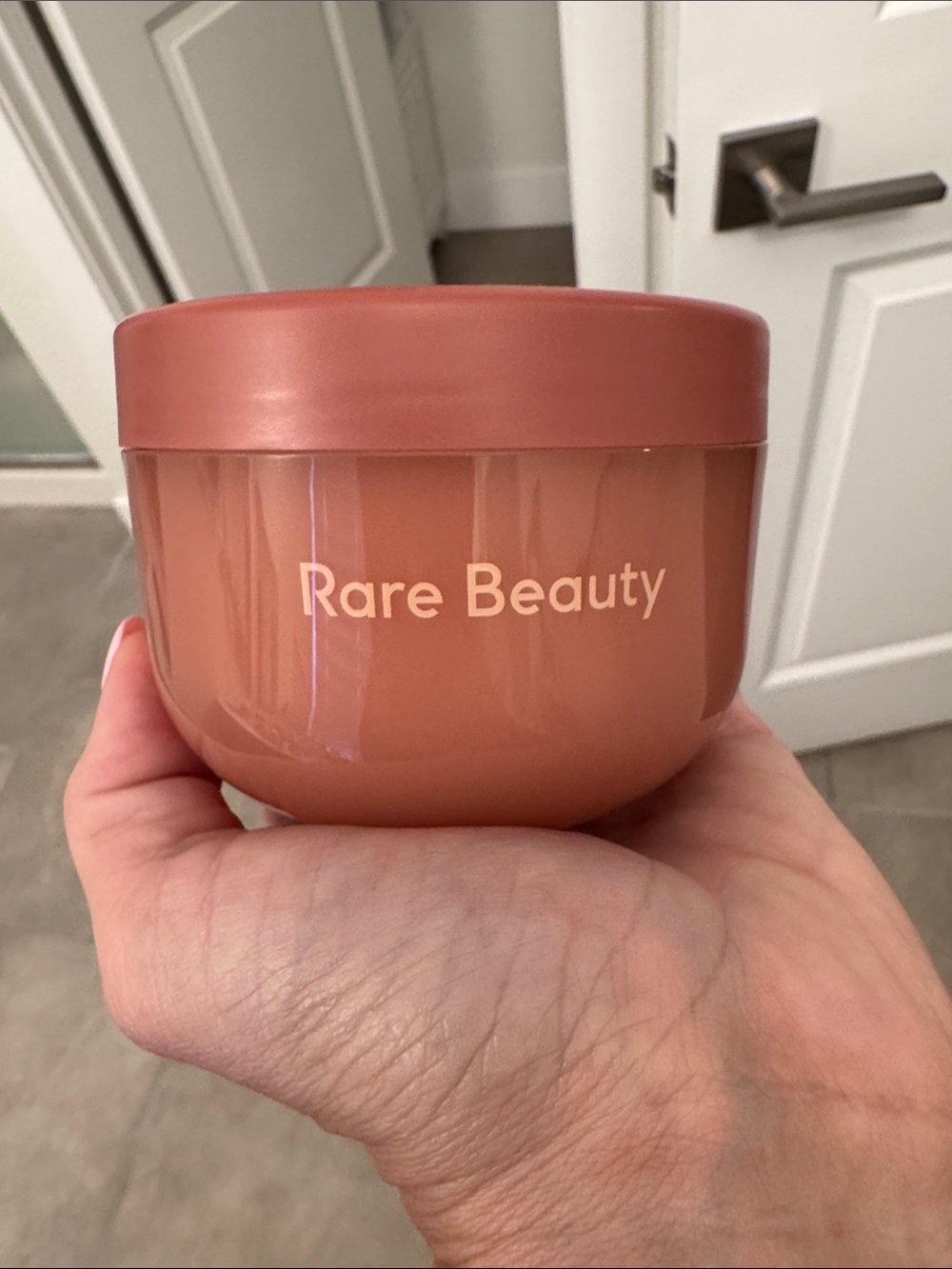 Rare Beauty terra-cotta pink cream jar